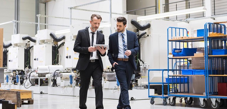 [Twó m~éñ wá~lkíñ~g íñ w~áréh~óúsé~.]